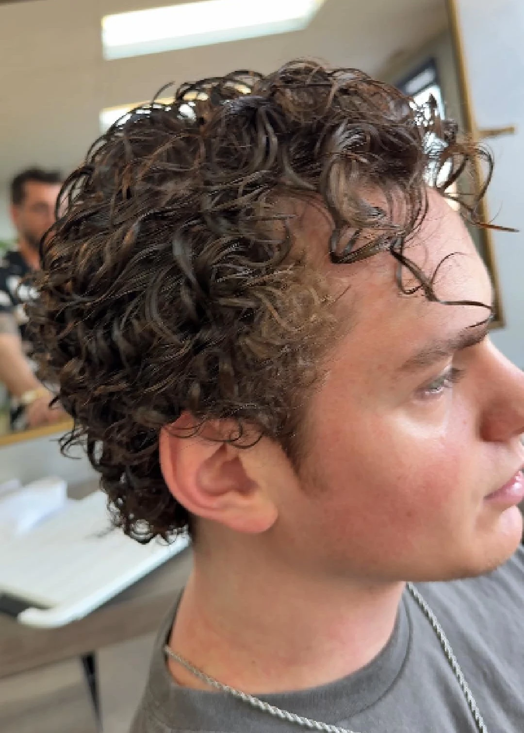 Perm shown before the haircut, side view